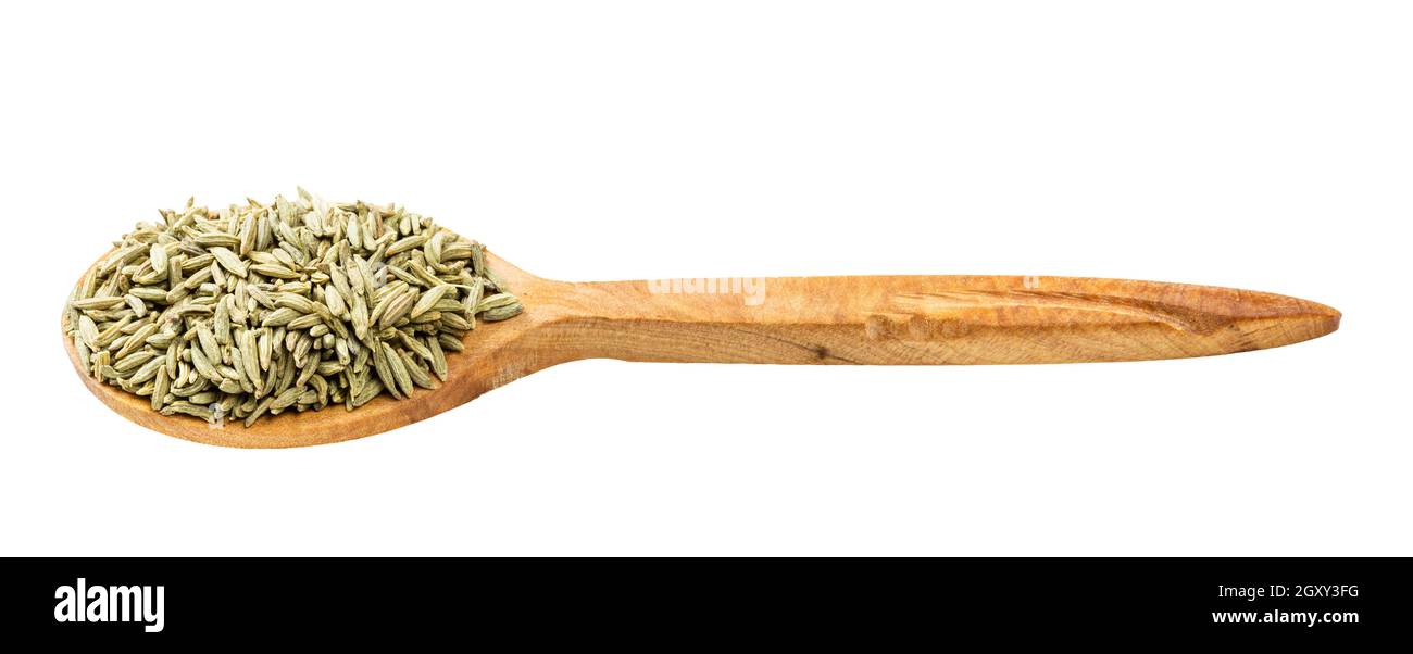 wooden spoon with anise seeds isolated on white background Stock Photo