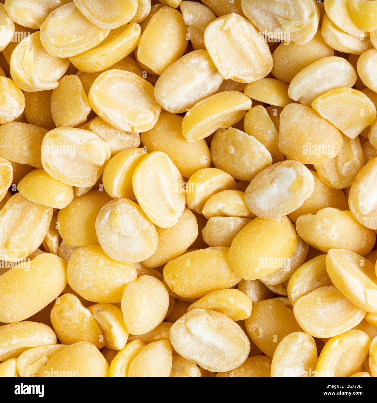 square food background - raw moong dal (split green mung) beans close up Stock Photo