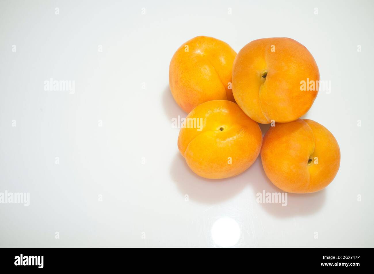 Spanish apricots heap. Isolated over white Stock Photo Alamy