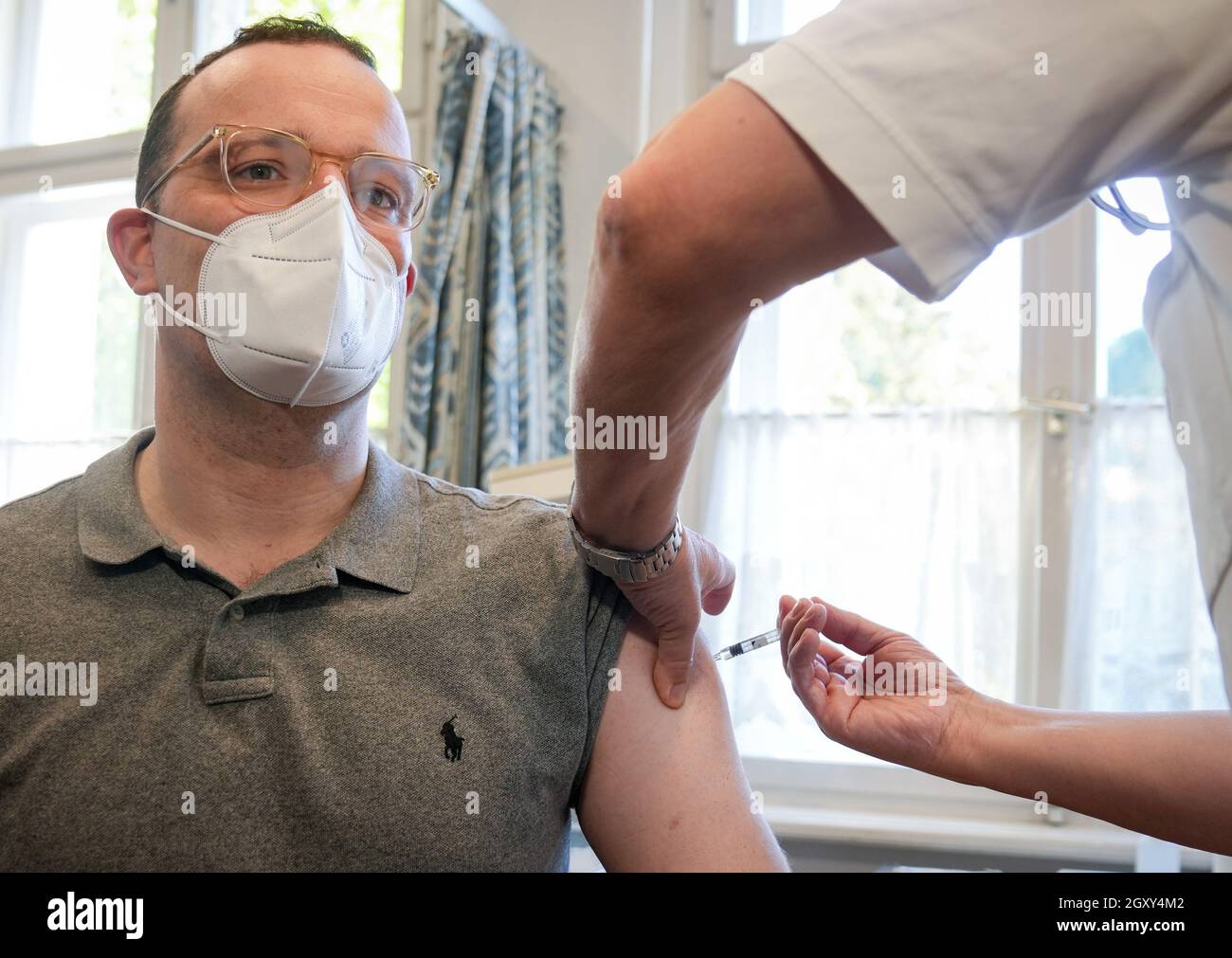 German Health Minister Jens Spahn receives a flu vaccination from doctor Christian Bohle in Berlin, Germany, October 6, 2021. Kay Nietfeld/Pool via REUTERS Stock Photo