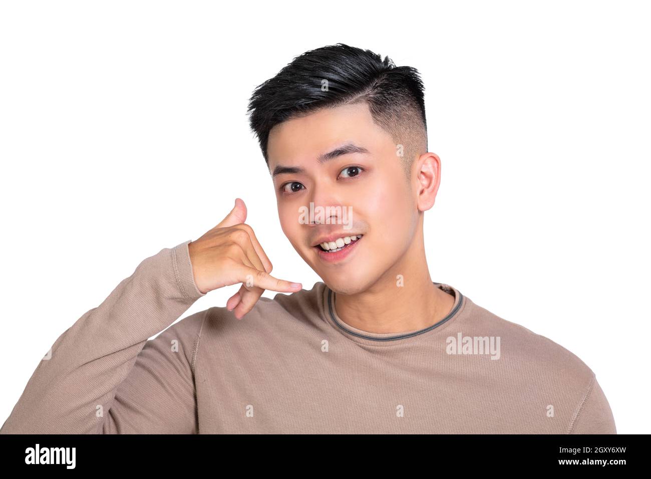 Young man doing phone gesture like says call me back Stock Photo
