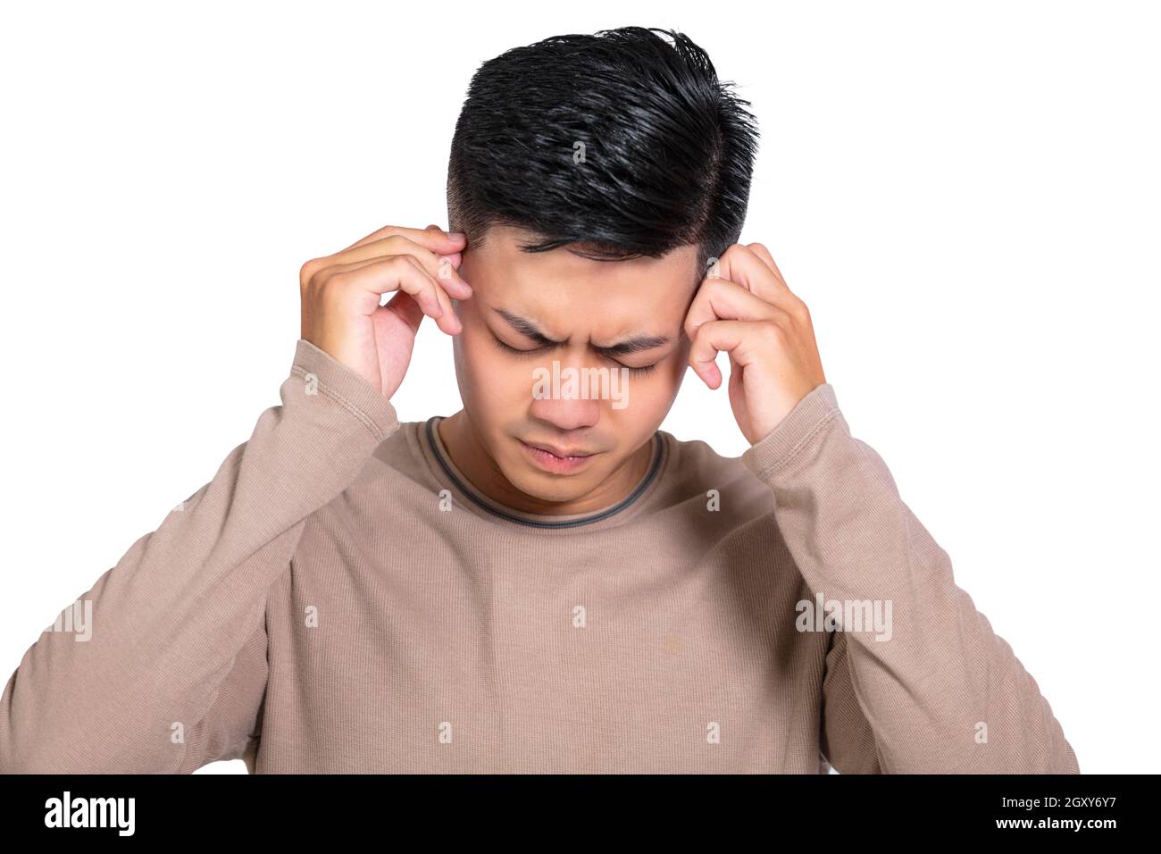 Young Man having headache isolated on white Stock Photo
