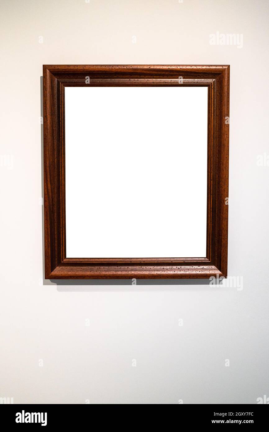 old vertical wide dark brown wooden picture frame with cutout canvas on