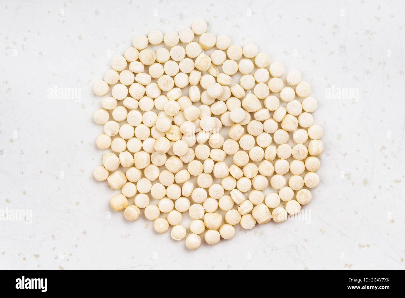 top view of pile of israeli pearl couscous close up on gray ceramic plate Stock Photo