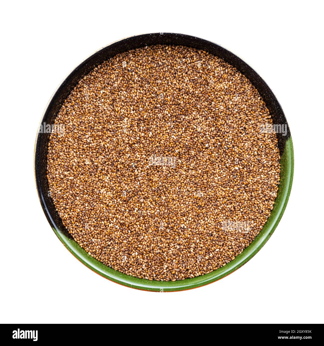 top view of whole-grain teff seeds in round bowl isolated on white background Stock Photo