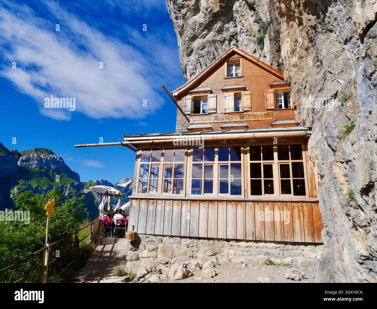 Aescher, Switzerland's iconic cliffhanging mountain restaurant, most beautiful place in world. Alpstein, Appenzell. Stock Photo