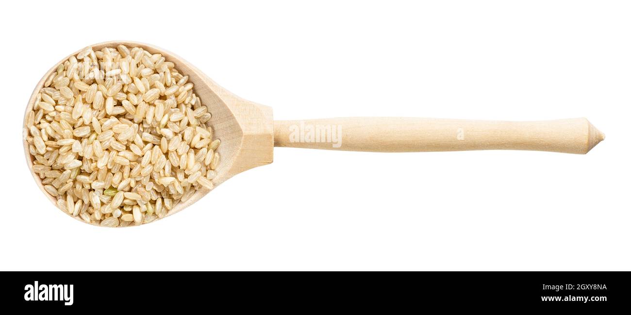 top view of wood spoon with unpolished brown rice grains isolated on ...
