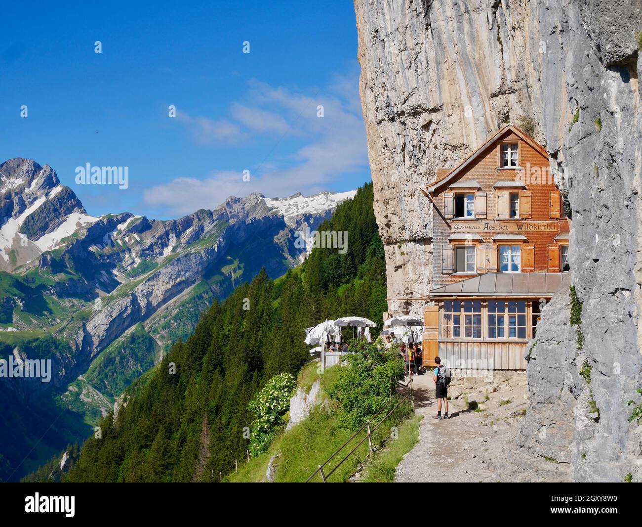 Aescher, Switzerland's iconic cliffhanging mountain restaurant, most beautiful place in world. Alpstein, Appenzell. Stock Photo
