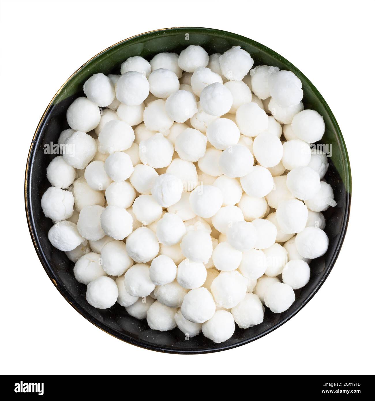 top view of raw tapioca pearls in round bowl isolated on white ...