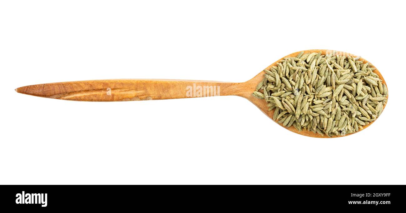top view of wood spoon with anise seeds isolated on white background Stock Photo