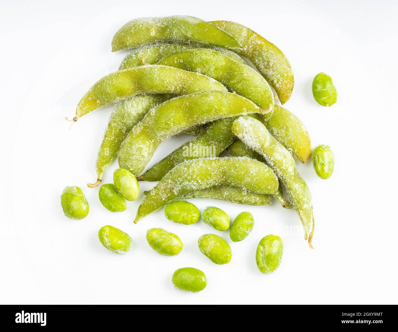 top view of frozen pods and seeds of Edamame (unripe soybeans) on gray