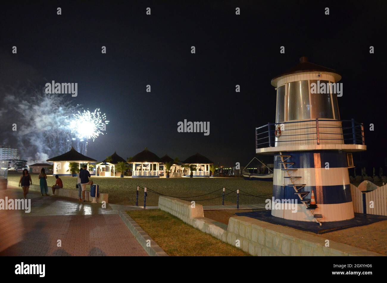 Tiny lighthouse and fireworks on Vega beach in Mamaia, Romania Stock Photo