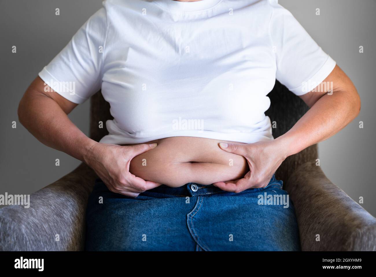 Woman fat clothes tight hi-res stock photography and images - Alamy