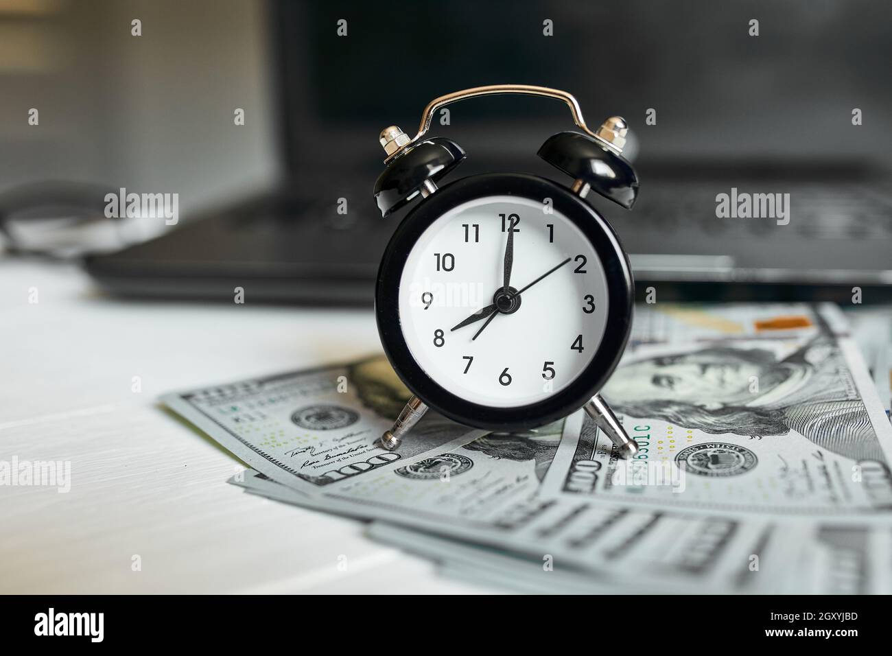 Modern Workplace Of Laptop Clock Money Dollars Banknote With Copy Space On White Wooden Background Time For Money Stock Photo Alamy
