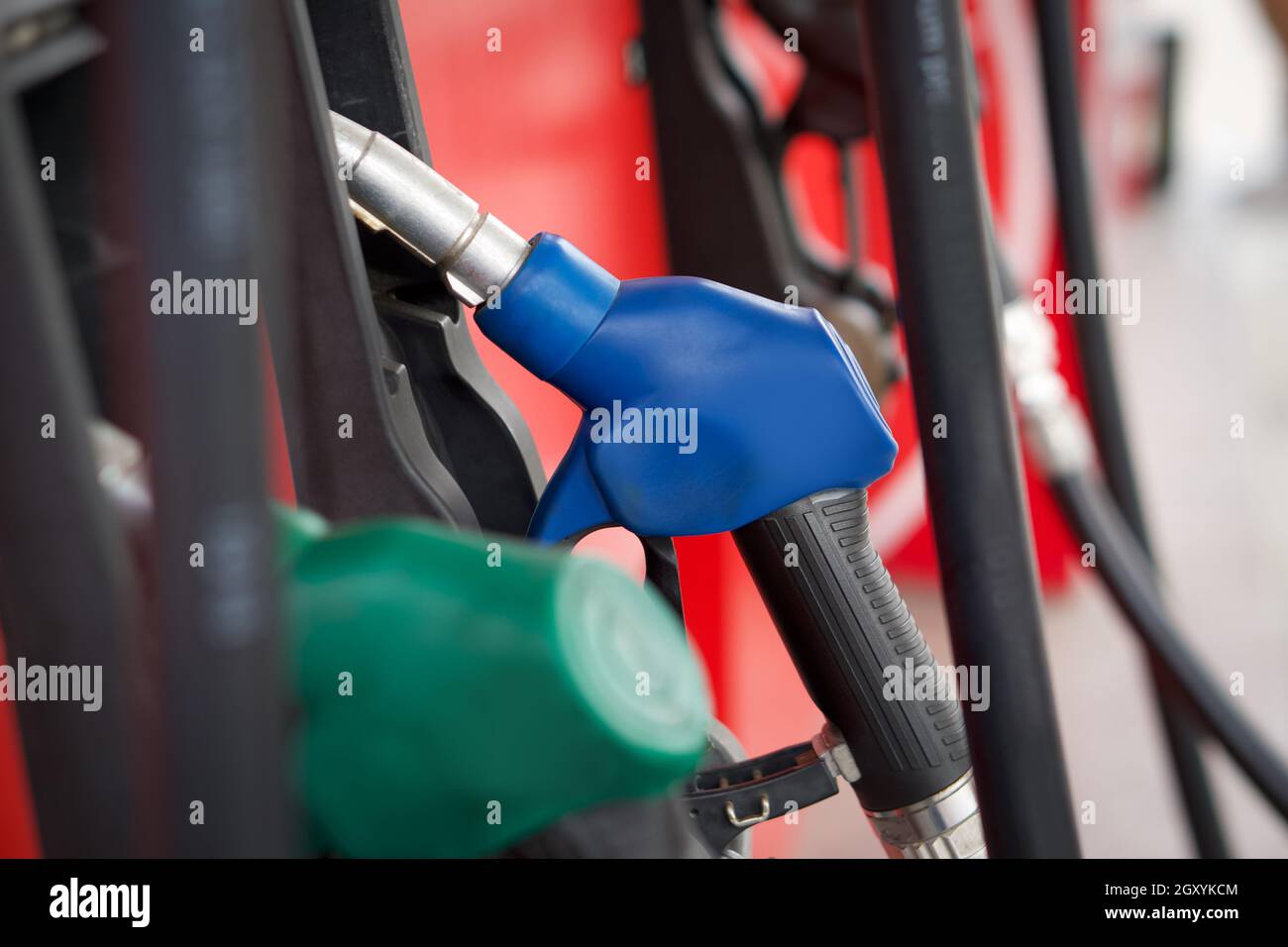Closeup blue gas pump nozzle in gas station Stock Photo Alamy