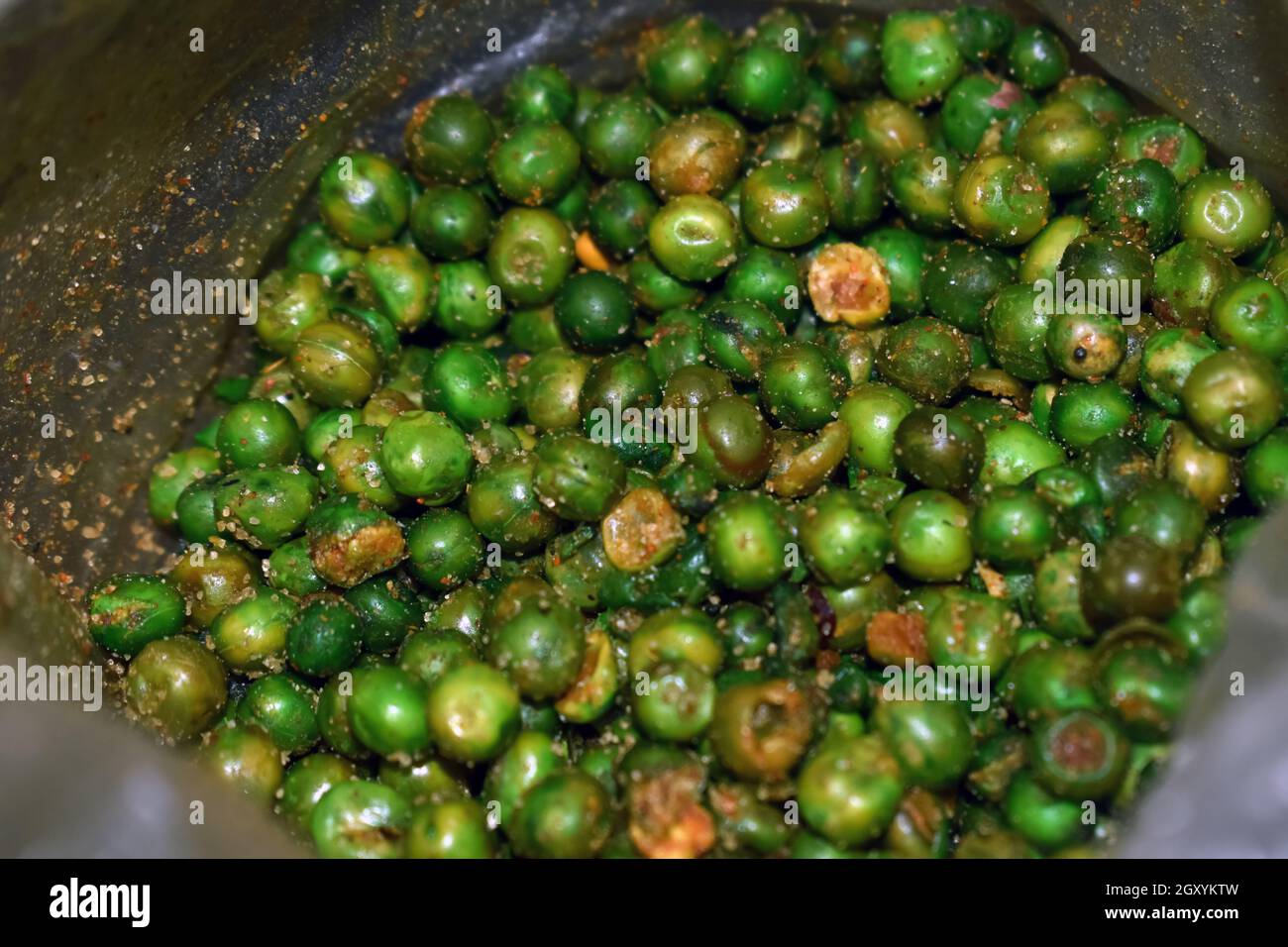 Overhead view of fried and salted green peas, A closeup shot of green
