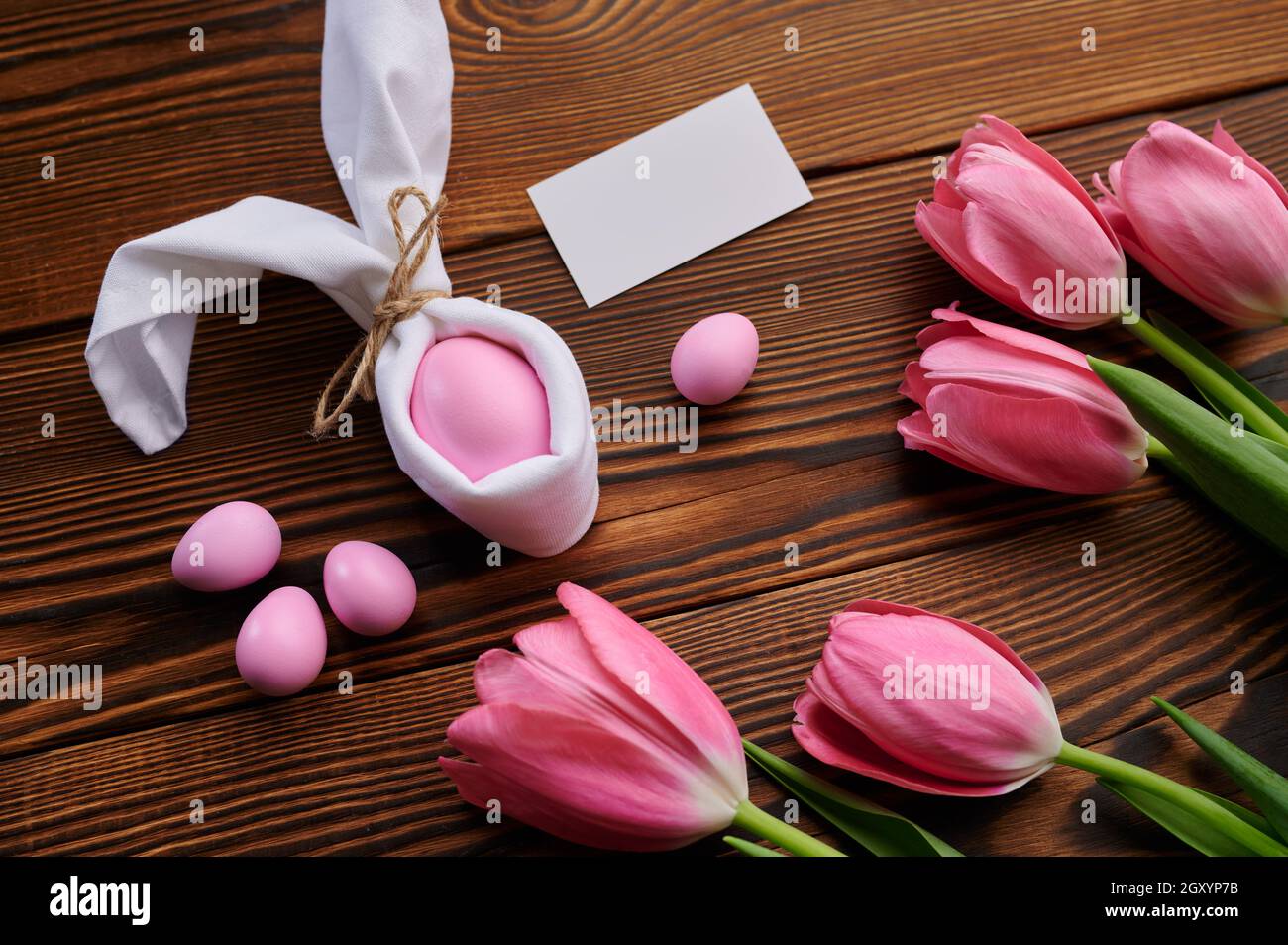 Pink tulips and easter egg on wooden background. Spring flowers ...
