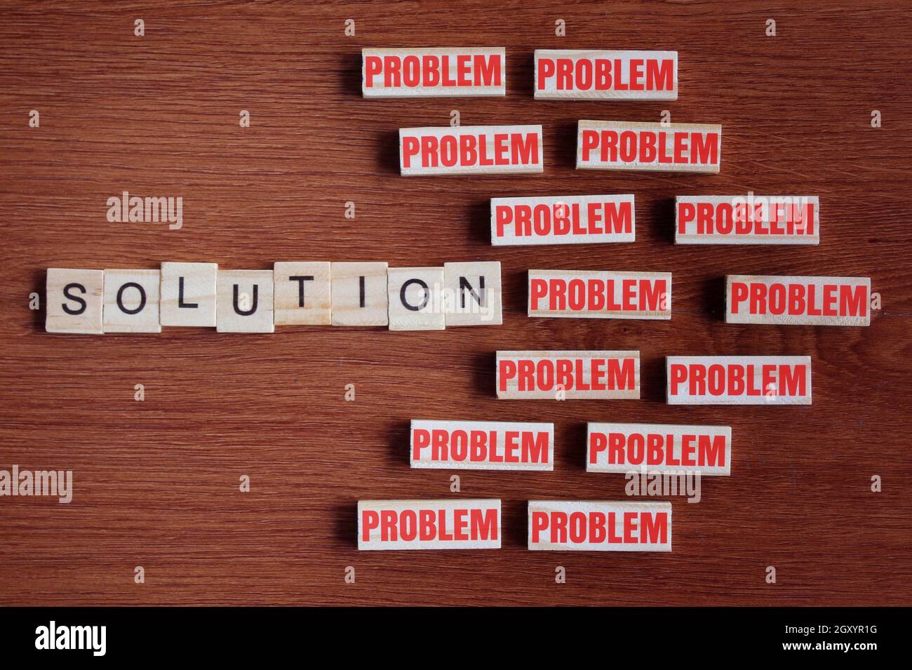 Concept of problem solving. Look for the solution inside the problem. Top view of wooden tiles with text PROBLEM and SOLUTION Stock Photo