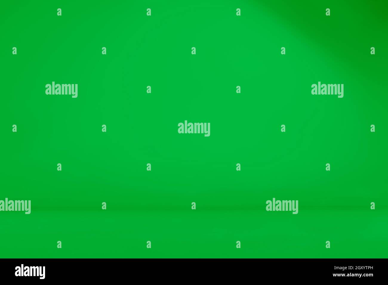 Empty green room. Seamless chroma key, green screen videography backdrop. Infinity curve, cyc wall, cyclorama. Stock Photo