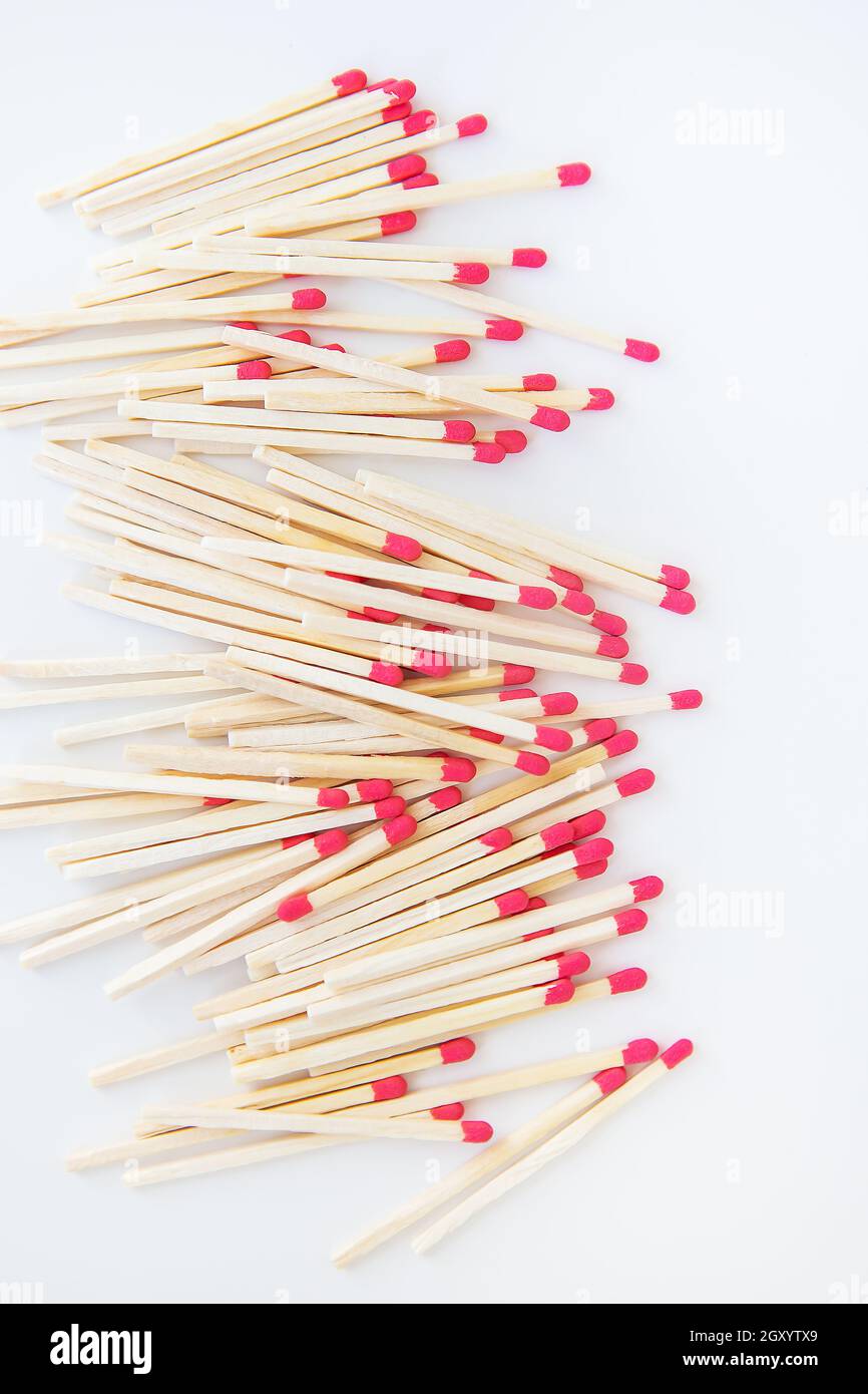 Long matches with a red head on a white background. Kitchen, ignition
