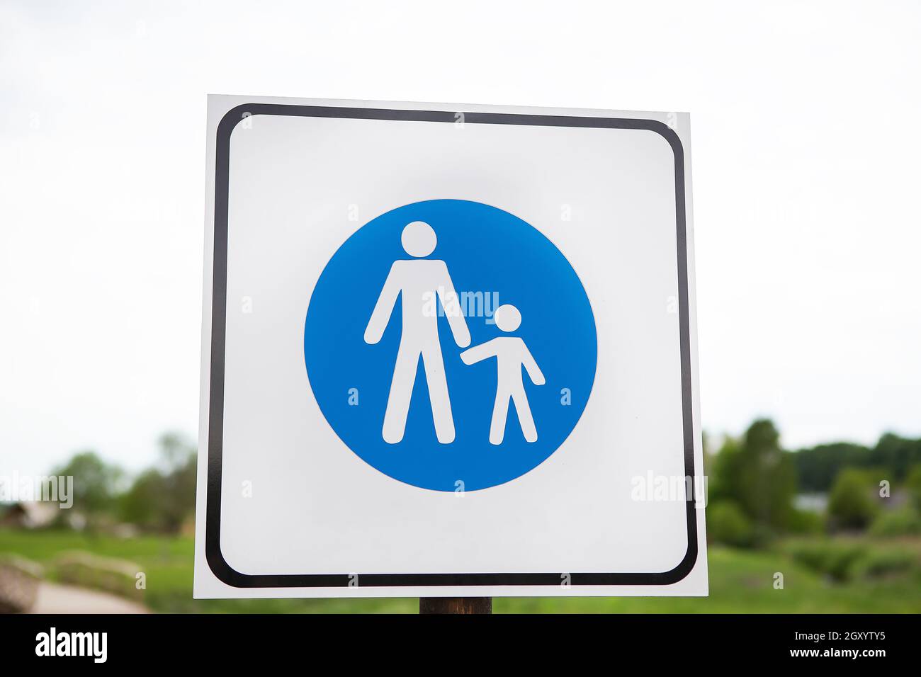 Road blue sign adults and children. Safety and caution concept. Safety