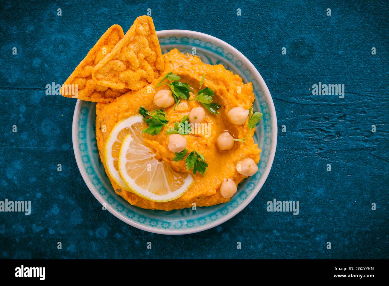 Homemade spicy humus chilli and chickpeas tortilla chips Stock Photo