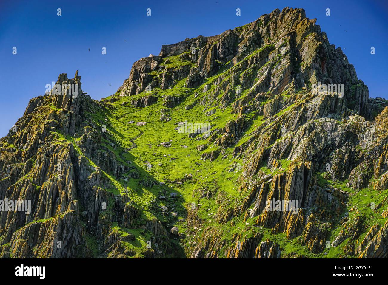 Steep stairs carved in stone on Skellig Michael island leading to