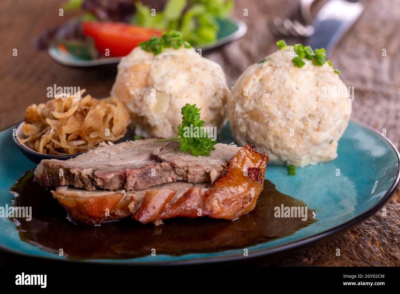 bavarian roast pork with dumplings Stock Photo Alamy