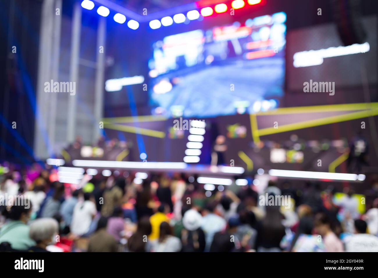 Abstract blur people in exhibition hall event computer game show festival background. Stock Photo