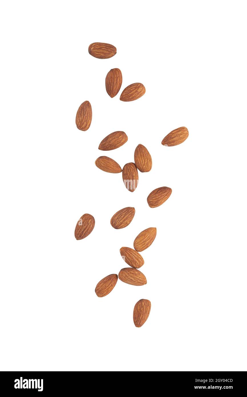 Almonds falling isolated on white background with clipping path. Stock Photo