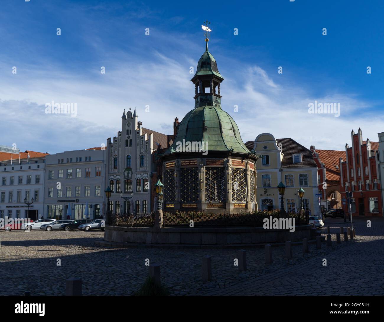 Famous fountain on the huge market place in Wismar with cloudy sky