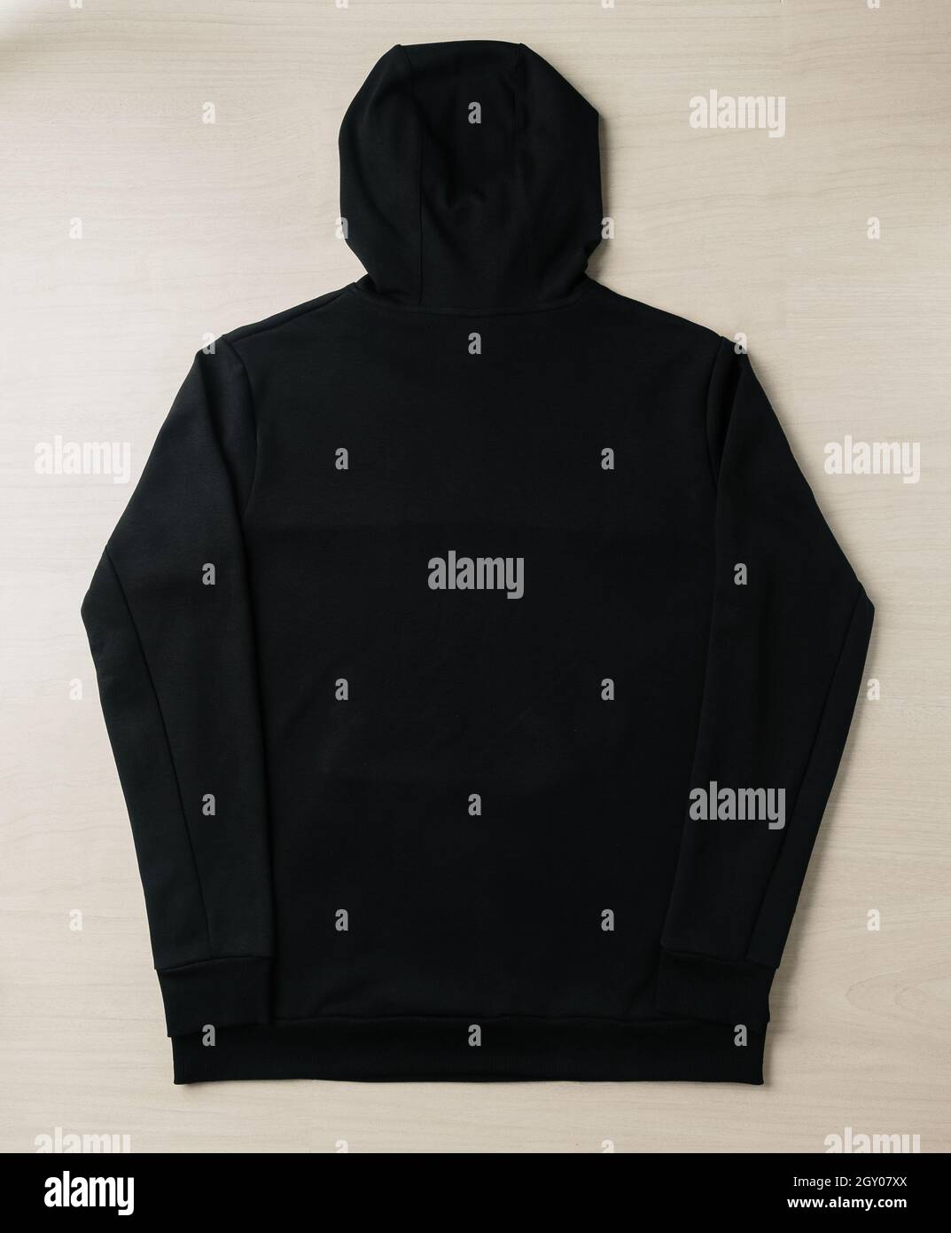 Blank black hoodie sweatshirt long sleeve mockup plank on the floor.  Template for place your design Stock Photo - Alamy