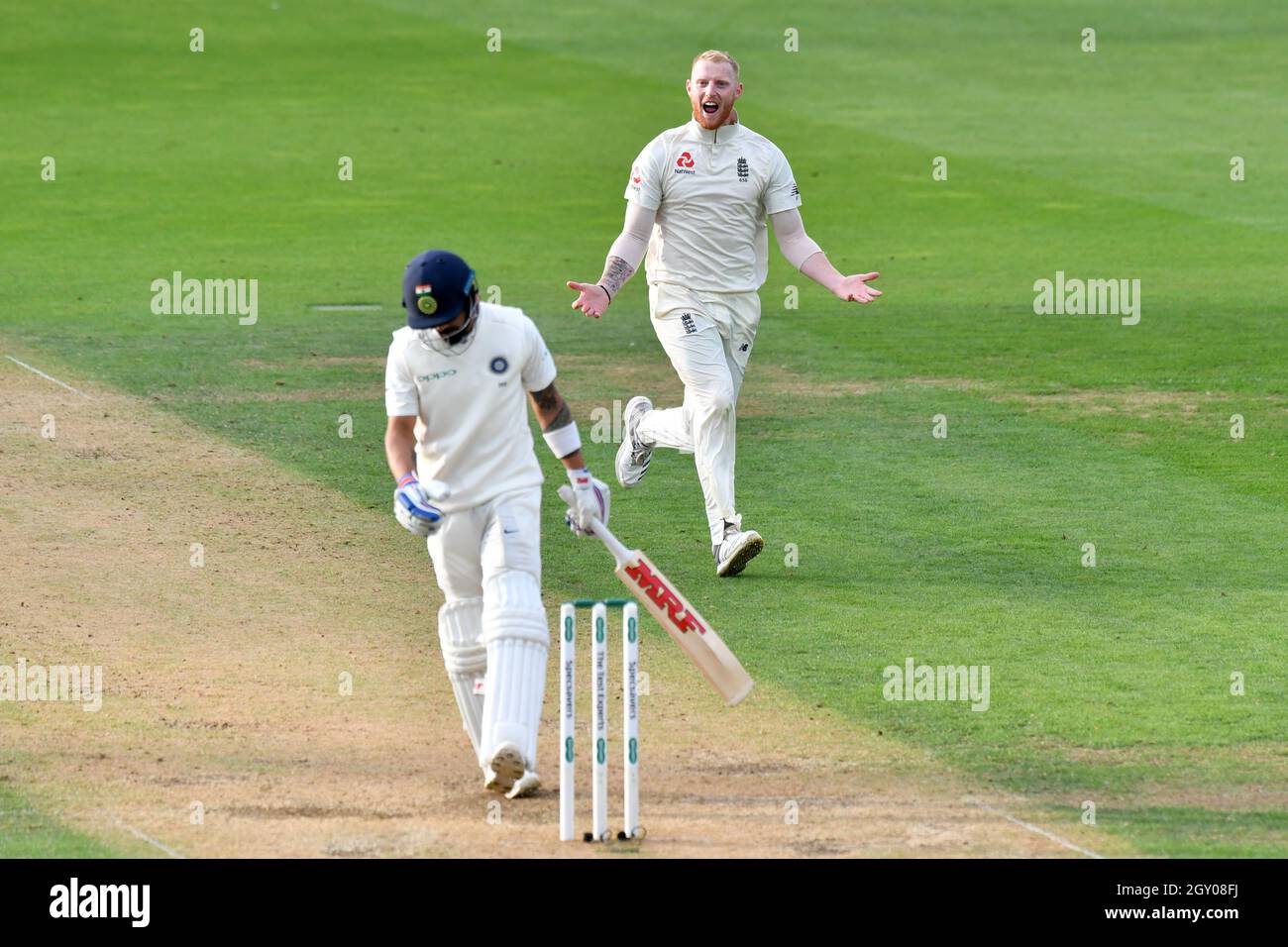 England’s Ben Stokes celebrates taking the wicket of India’s captain Virat Kohli during the test match at The Kia Oval, London. Stock Photo