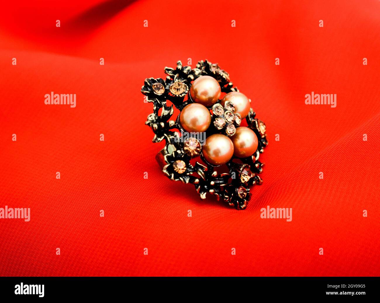 picture of a Fashion ring. Red background Stock Photo - Alamy