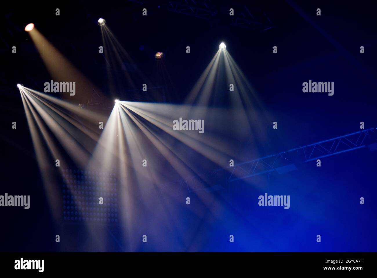Stage lights glowing in the dark. Live music festival concept background Stock Photo