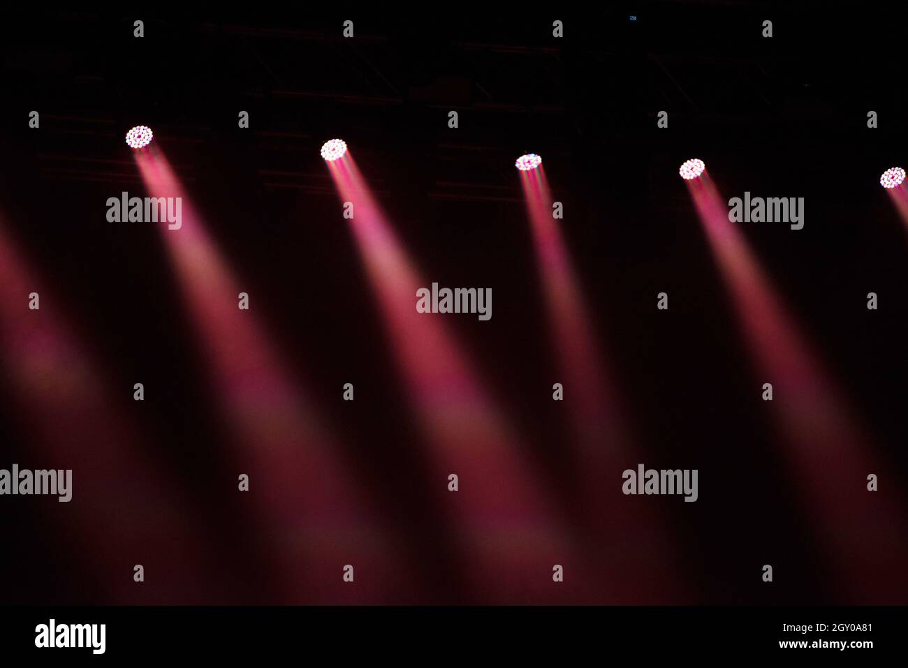 Stage lights glowing in the dark. Live music festival concept background Stock Photo