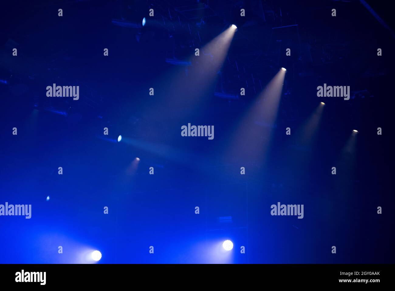 Stage lights glowing in the dark. Live music festival concept background Stock Photo