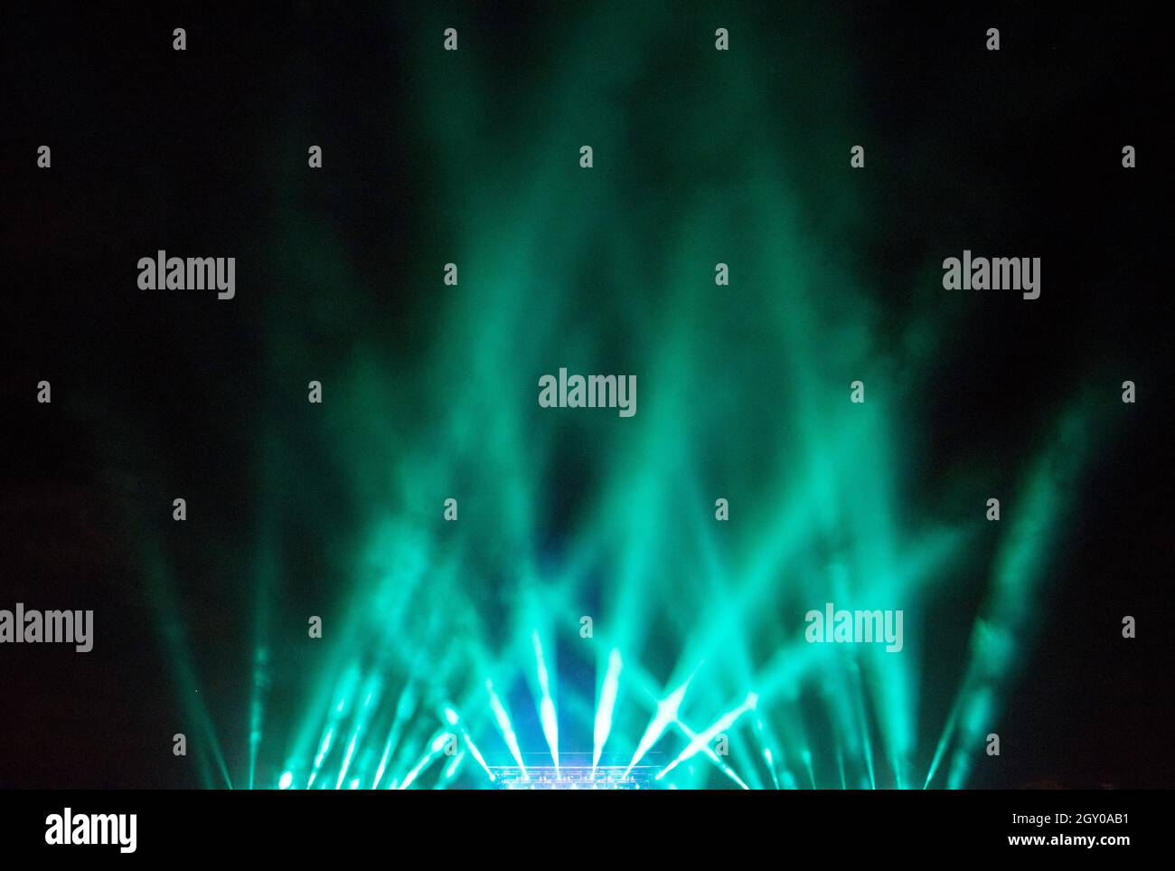 Stage lights glowing in the dark. Live music festival concept background Stock Photo