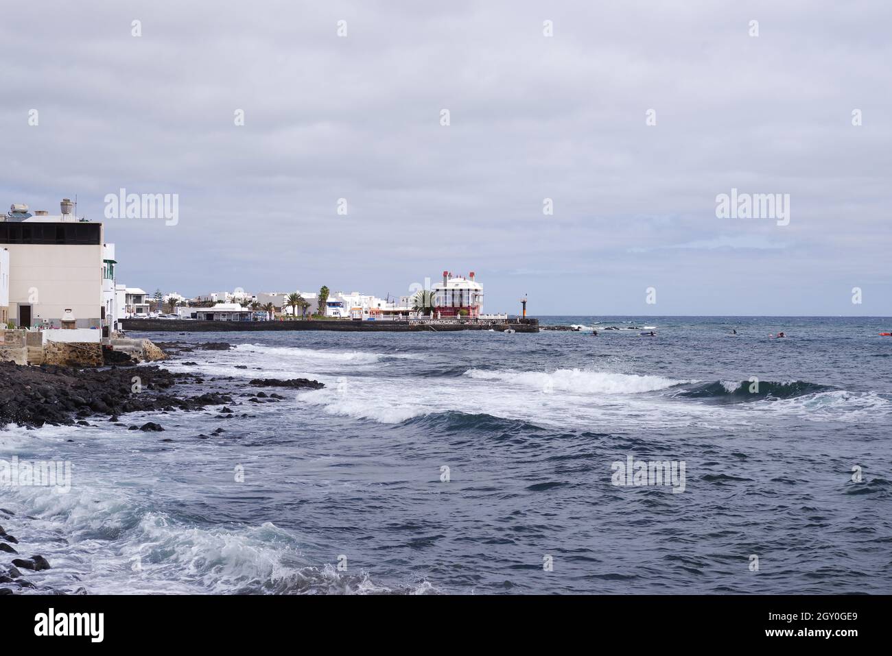 Local landmark, the unusual coastal house Casa La Juanita (The Blue House) next to Playa del Charcon - Arrieta, Lanzarote (Canary Islands) Stock Photo