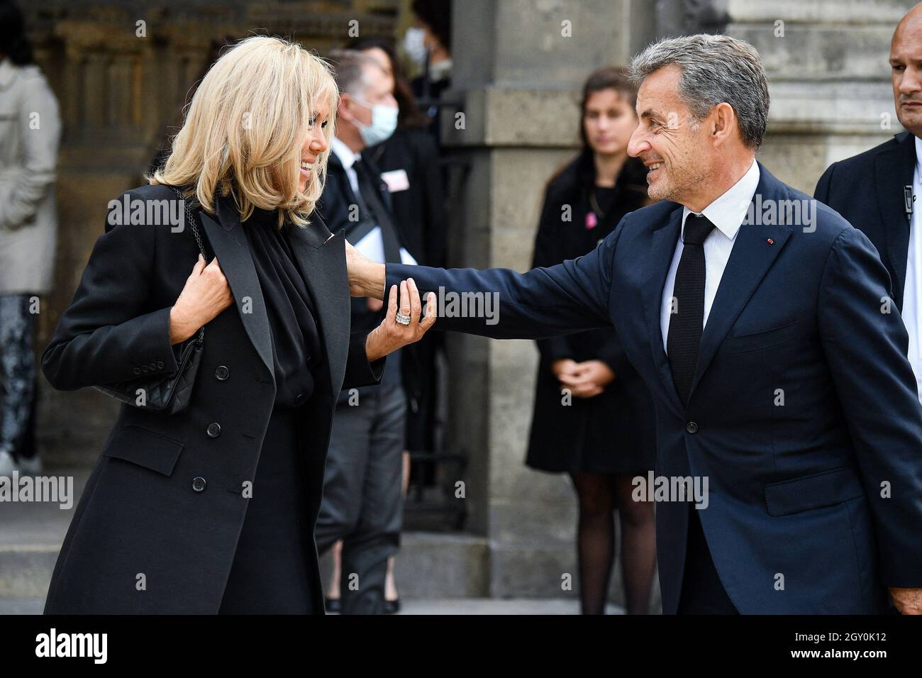 Brigitte Macron and Nicolas Sarkozy during a tribute mass for French tycoon Bernard  Tapie at Saint Germain des Pres church in Paris, France on October 6, 2021.  The funeral will be held