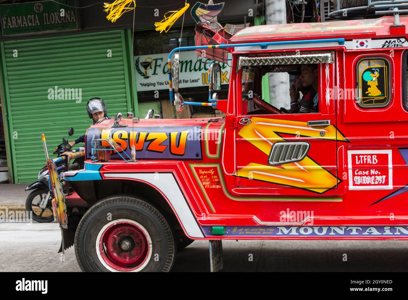 A red jeepney in the streets of Baguio city, Philippines Stock Photo