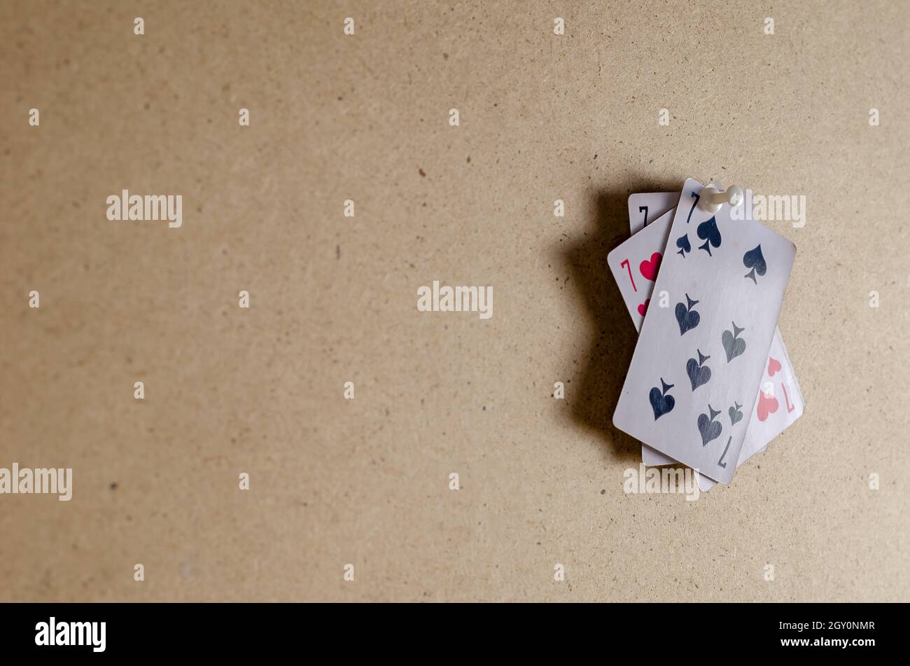 The seven of spades, clubs, diamonds, and hearts. Four playing cards