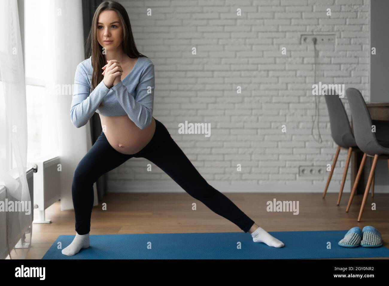 Beautiful pregnant woman doing exercises at home. Side Lunge Squat Stock  Photo - Alamy