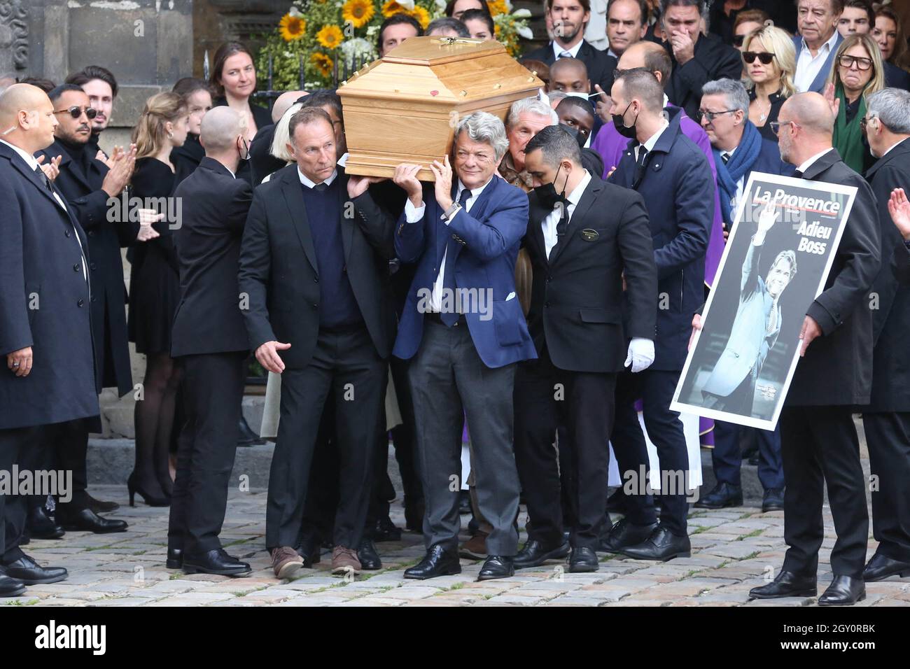 Jean-Pierre Papin and Jean-Louis Borloo carry the coffin during a tribute  mass for French tycoon Bernard Tapie at Saint Germain des Pres church in  Paris, France on October 6, 2021. The funeral