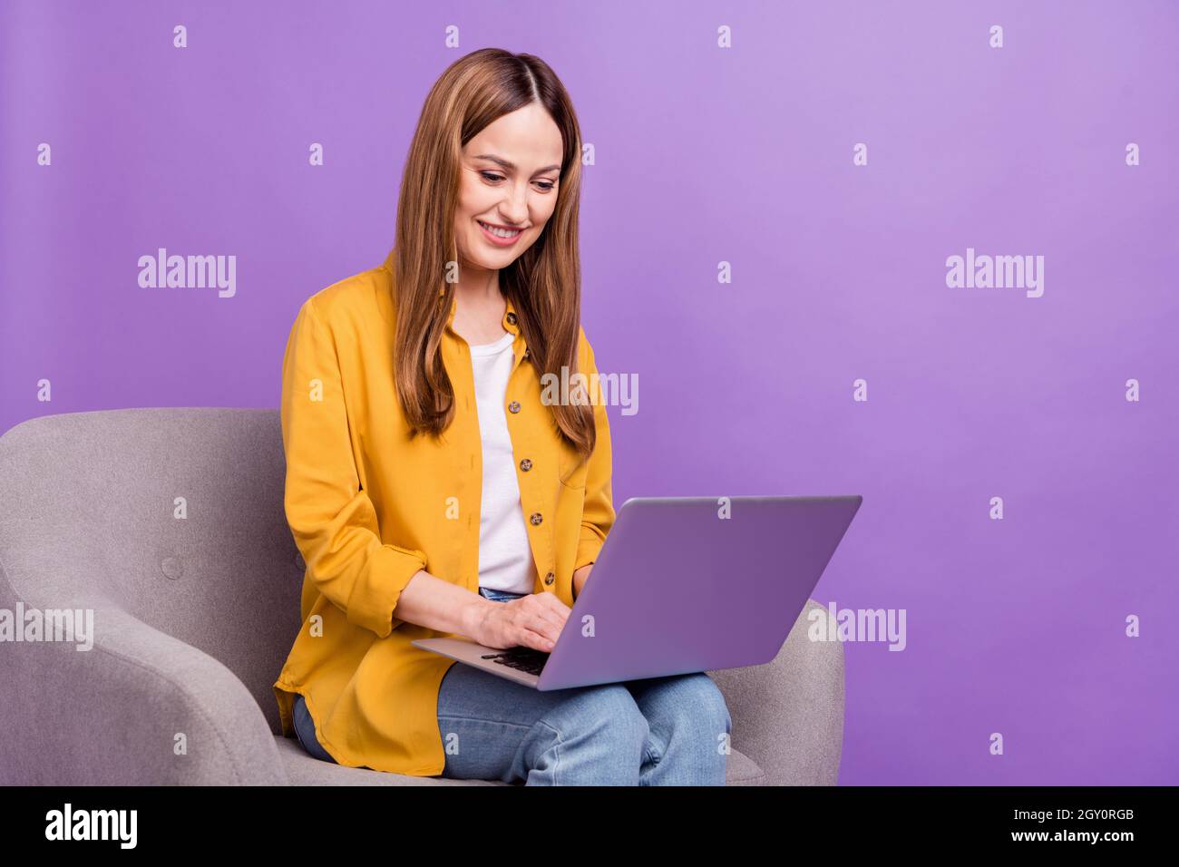 Profile side photo of business woman look read browse laptop virtual isolated over purple color background Stock Photo