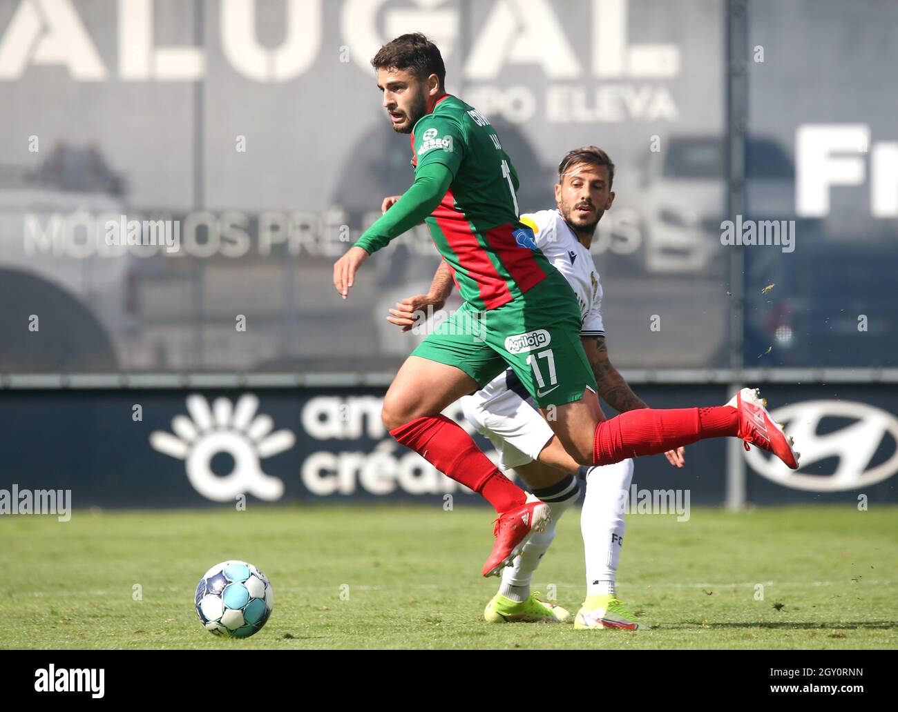FAMALICAO, PORTUGAL - SEPTEMBER 18: Bruno Xadas of CS Maritimo competes for the ball with Diogo Figueiras FC Famalicao ,during the Liga Portugal Bwin match between FC Famalicao and CS Maritimo at Estadio Municipal on September 18, 2021 in Famalicao, Portugal. (Photo by MB Media) Stock Photo