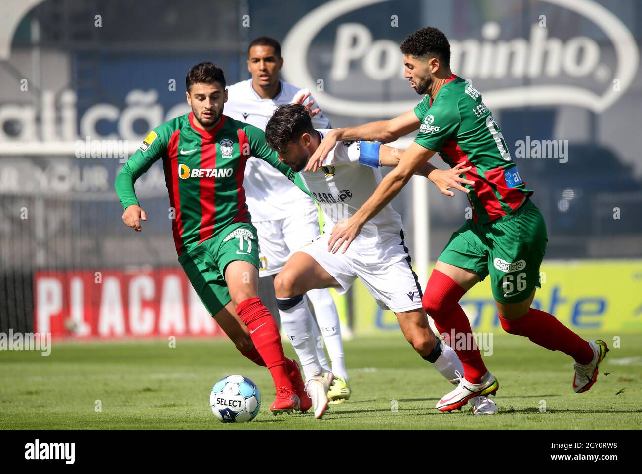 FAMALICAO, PORTUGAL - SEPTEMBER 18: Ivo Rodrigues of FC Famalicao competes for the ball with Bruno Xadas and Leo Andrade of CS Maritimo ,during the Liga Portugal Bwin match between FC Famalicao and CS Maritimo at Estadio Municipal on September 18, 2021 in Famalicao, Portugal. (Photo by MB Media) Stock Photo