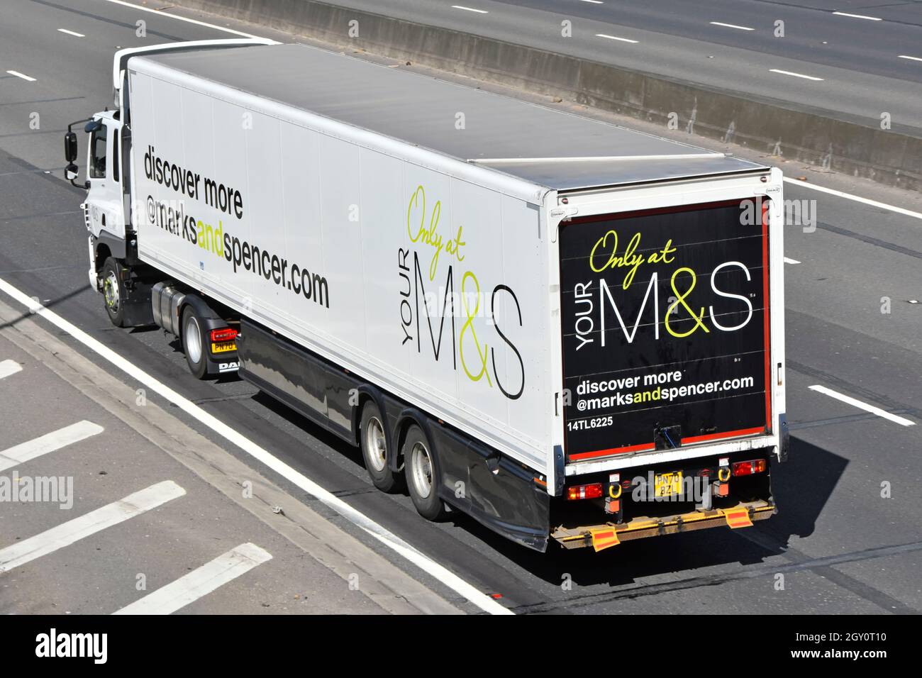 Side & back view Marks and Spencer retail business store delivery supply chain hgv lorry truck & trailer with M&S discover advertising on UK motorway Stock Photo