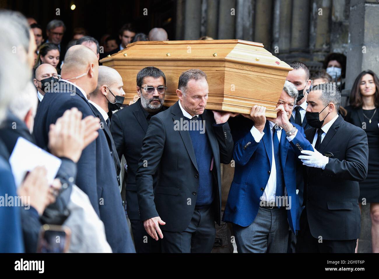 Stephane Tapie, Jean-Pierre Papin and Jean-Louis Borloo, Claude Lelouch  carry the coffin during a tribute mass for French tycoon Bernard Tapie at  Saint Germain des Pres church in Paris, France on October