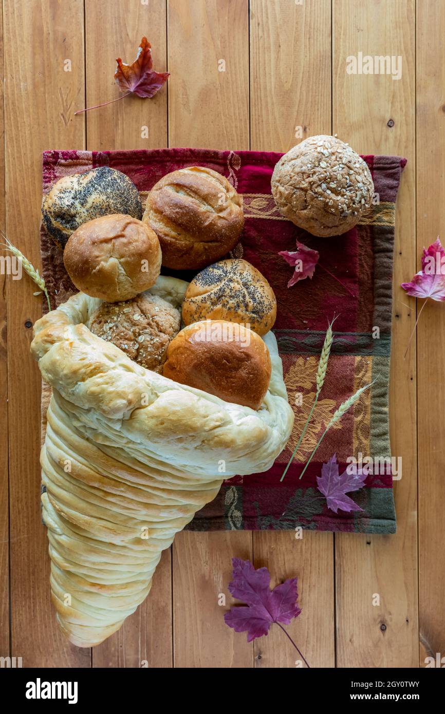 A cornucopia made of bread for Thanksgiving filled with a variety of